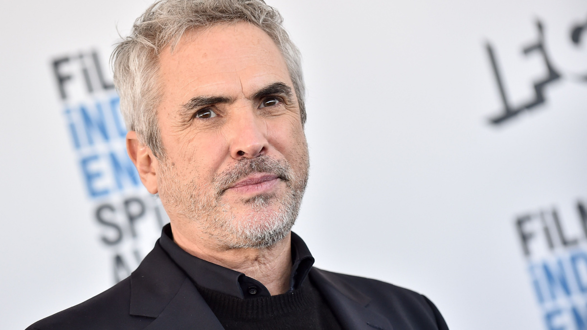 Alfonso Cuaron will direct a biopic about the author of “Blade Runner” along with Charlize Theron