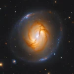 Image d’une galaxie lointaine avec en son centre un trou noir ultramassif estimé à 36 milliards de masses solaires.