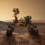 Le rover Perseverance de la NASA photographié sur le sol martien, explorant un paysage rocheux sous un ciel orangé.