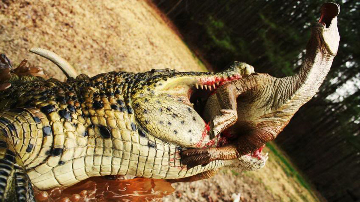 Un crocodilien préhistorique qui dévore un dinosaure