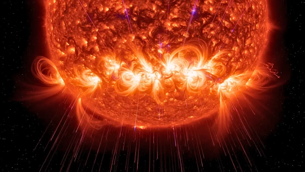 Éruption solaire vue de près, avec d’immenses arcs de plasma incandescent projetés dans l’espace.