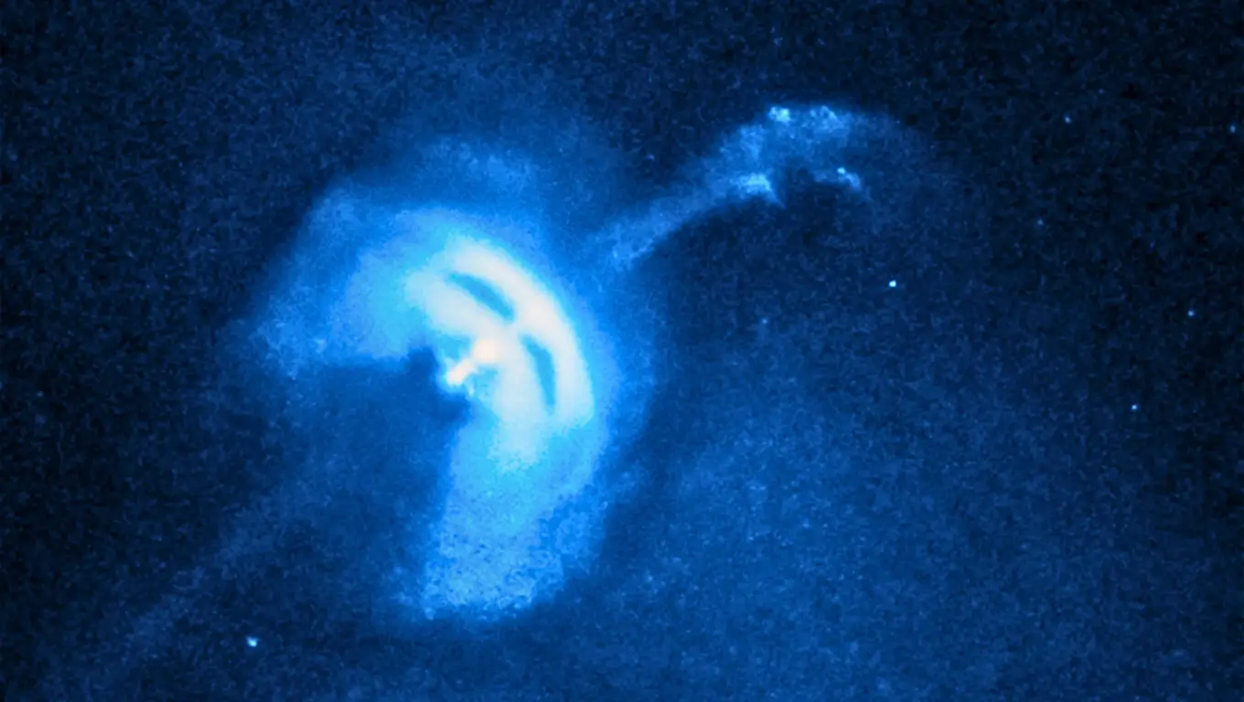 Image du pulsar de Vela émettant des jets de particules bleutés, observé dans l’espace profond.