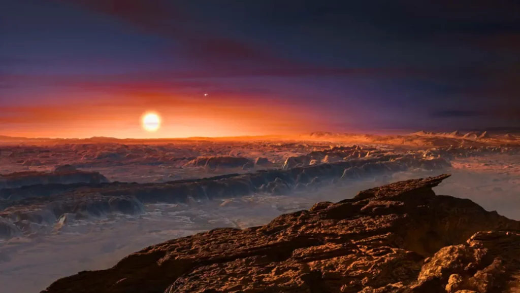 Vue d’artiste de la surface rocheuse de l’exoplanète Proxima b, illuminée par le coucher de son étoile rouge Proxima Centauri, sur fond de ciel crépusculaire.