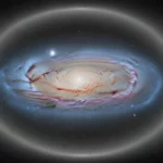 Illustration montrant la Voie lactée vue de dessus, entourée d’un vaste halo lumineux dans l’espace profond.