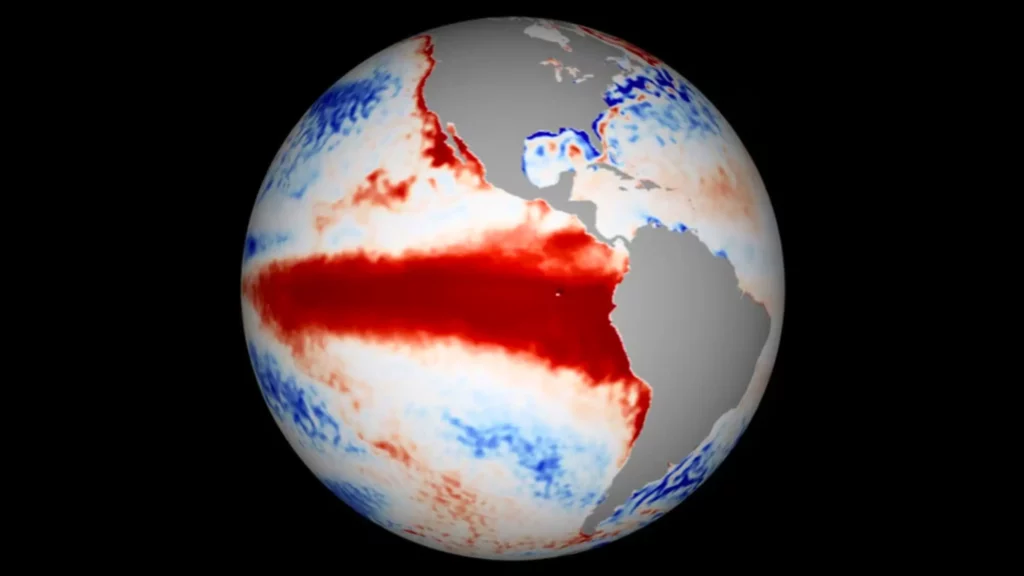Carte mondiale montrant une anomalie de température de surface de la mer avec une large bande rouge intense dans le Pacifique équatorial, typique d’un épisode El Niño.
